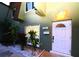 Inviting home exterior featuring a well-lit entrance, decorative door, and manicured landscaping at 1330 70Th N St, St Petersburg, FL 33710