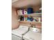 Functional laundry area with shelving above a washer and dryer for storage and convenience at 1330 70Th N St, St Petersburg, FL 33710