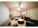 Cozy living room with a large sectional sofa, ceiling fan, and mounted TV at 1330 70Th N St, St Petersburg, FL 33710