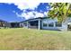Spacious backyard with screened patio and lush lawn at 13307 Fawn Lily Dr, Riverview, FL 33579