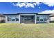 Screened patio and grassy backyard at 13307 Fawn Lily Dr, Riverview, FL 33579