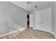 Simple bedroom with wood-look floors and double door closet at 13307 Fawn Lily Dr, Riverview, FL 33579