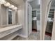 Spacious closet with built-in shelving and mirrored vanity at 13307 Fawn Lily Dr, Riverview, FL 33579