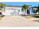 Attractive home exterior with a white garage door and paver driveway at 13307 Fawn Lily Dr, Riverview, FL 33579