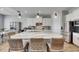 Spacious kitchen with granite island, stainless steel appliances, and white cabinetry at 13307 Fawn Lily Dr, Riverview, FL 33579