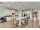 Modern kitchen with white cabinetry, large island, and stainless steel appliances at 13307 Fawn Lily Dr, Riverview, FL 33579