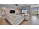 Living area features a large sectional sofa and a view of the backyard and pool at 13307 Fawn Lily Dr, Riverview, FL 33579