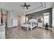 Spacious main bedroom with wood-look floors and an accent wall at 13307 Fawn Lily Dr, Riverview, FL 33579