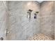 Large walk-in shower with dual shower heads and pebble floor at 13307 Fawn Lily Dr, Riverview, FL 33579