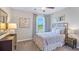 Charming bedroom with a comfy bed, nightstands, and window at 1715 Tahitian Sunrise Dr, Plant City, FL 33565
