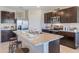 Modern kitchen with island, stainless steel appliances, and granite countertops at 1715 Tahitian Sunrise Dr, Plant City, FL 33565