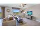 Living room with sectional sofa and view of backyard at 1715 Tahitian Sunrise Dr, Plant City, FL 33565