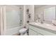 Clean bathroom with single vanity, tub, and shower at 1716 Tahitian Sunrise Dr, Plant City, FL 33565