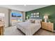 Spacious bedroom with large window and neutral decor at 1716 Tahitian Sunrise Dr, Plant City, FL 33565