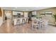 Open concept kitchen and dining area with modern fixtures at 1716 Tahitian Sunrise Dr, Plant City, FL 33565