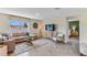 Spacious living room with a neutral color scheme and lots of natural light at 1716 Tahitian Sunrise Dr, Plant City, FL 33565