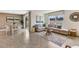 Combined living and dining area with large windows and neutral decor at 1716 Tahitian Sunrise Dr, Plant City, FL 33565