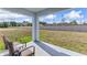 Covered patio overlooking a grassy backyard at 1716 Tahitian Sunrise Dr, Plant City, FL 33565