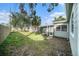 Backyard with shed, wooden fence, and lawn at 175 83Rd N Ave, St Petersburg, FL 33702