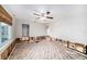 Bedroom with exposed walls and flooring, ceiling fan installed at 175 83Rd N Ave, St Petersburg, FL 33702