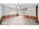 Bedroom with exposed walls and flooring, ceiling fan installed at 175 83Rd N Ave, St Petersburg, FL 33702