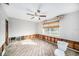 Bedroom with exposed walls and flooring, ceiling fan installed at 175 83Rd N Ave, St Petersburg, FL 33702