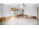 Bedroom with exposed walls and flooring, ceiling fan installed at 175 83Rd N Ave, St Petersburg, FL 33702
