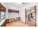 Unfinished dining area with exposed wooden walls and flooring at 175 83Rd N Ave, St Petersburg, FL 33702