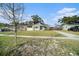 House exterior view, showcasing a renovated home with a landscaped yard at 175 83Rd N Ave, St Petersburg, FL 33702