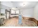 Unfinished kitchen with exposed walls, new cabinets, and wooden floors at 175 83Rd N Ave, St Petersburg, FL 33702