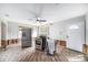 Renovation in progress: Kitchen with new appliances and exposed wooden floors at 175 83Rd N Ave, St Petersburg, FL 33702