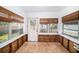 Unfinished sunroom with wood flooring and plenty of natural light at 175 83Rd N Ave, St Petersburg, FL 33702
