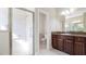 Bathroom featuring a clear glass shower with a seating area and handrails at 1838 Tallulah Ter, Wesley Chapel, FL 33543