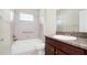 Bathroom features a shower-tub combination and granite counters at 1838 Tallulah Ter, Wesley Chapel, FL 33543