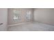 Neutral bedroom with two windows and carpeted floors at 1838 Tallulah Ter, Wesley Chapel, FL 33543