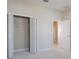 Bedroom with open closet at 1838 Tallulah Ter, Wesley Chapel, FL 33543
