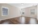 Bright bedroom with wood floors, ample natural light, and neutral color palette at 1838 Tallulah Ter, Wesley Chapel, FL 33543