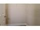 Walk-in closet featuring white walls, white shelves, and a light-colored door at 1838 Tallulah Ter, Wesley Chapel, FL 33543
