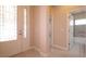 Bright foyer with decorative glass front door leads to the rest of the home at 1838 Tallulah Ter, Wesley Chapel, FL 33543