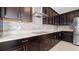 Well-equipped kitchen featuring stainless steel appliances, ample counter space, and modern vent hood for cooking enthusiasts at 1838 Tallulah Ter, Wesley Chapel, FL 33543