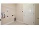 Utility room with tile floors, washer and dryer hookups, and closet at 1838 Tallulah Ter, Wesley Chapel, FL 33543