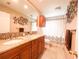 Bathroom with granite countertops and double sinks at 222 Mary Ellen Ave, Seffner, FL 33584