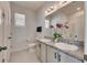 Bathroom with double vanity and granite countertops at 2584 89Th Street E Cir, Palmetto, FL 34221