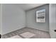 Bright bedroom with gray carpet and a window with blinds at 2584 89Th Street E Cir, Palmetto, FL 34221