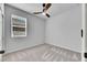 Simple bedroom featuring gray carpet and a ceiling fan at 2584 89Th Street E Cir, Palmetto, FL 34221