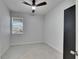 Simple bedroom with a window and ceiling fan at 2584 89Th Street E Cir, Palmetto, FL 34221