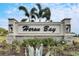 Community entrance sign for Heron Bay, welcoming residents and guests at 2584 89Th Street E Cir, Palmetto, FL 34221