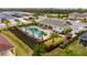 Relaxing community pool with surrounding landscaping at 2584 89Th Street E Cir, Palmetto, FL 34221