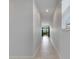 Bright hallway with tile flooring and view into the living area at 2584 89Th Street E Cir, Palmetto, FL 34221