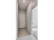 Clean hallway with tile flooring and a door to another room at 2584 89Th Street E Cir, Palmetto, FL 34221
